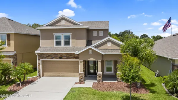 front view of a house with a yard
