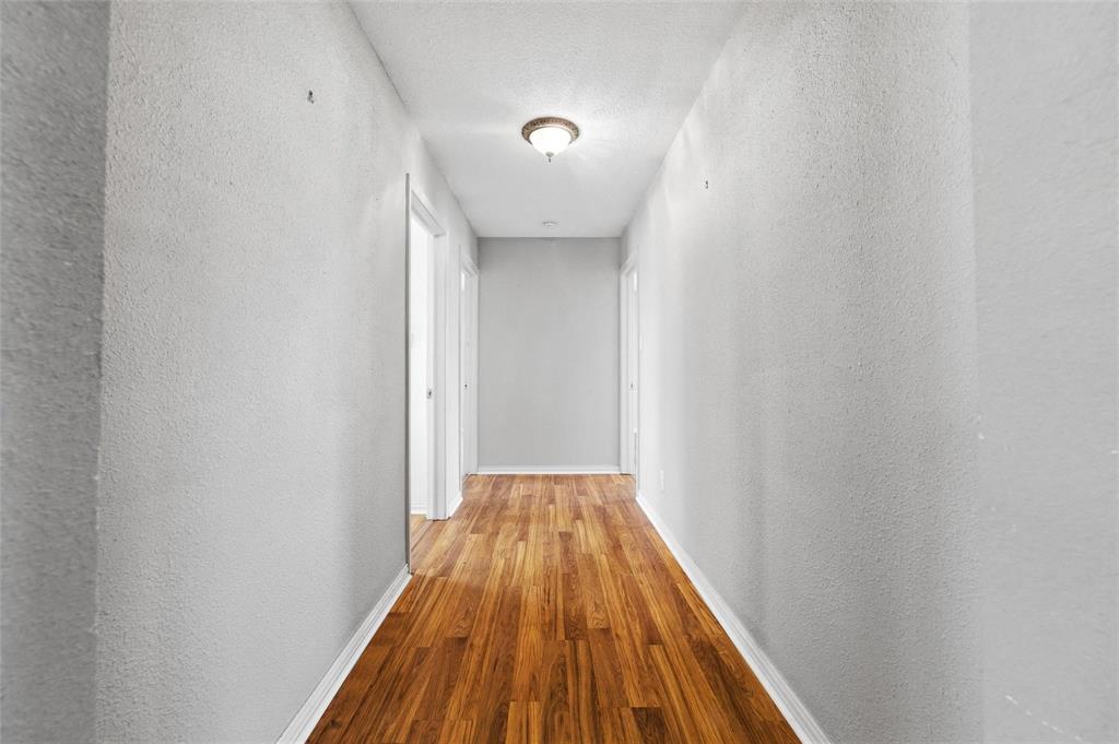 358 Wright Road Waxahachie, TX 75167 - Photo 27 of 38 a view of a hallway with wooden floor