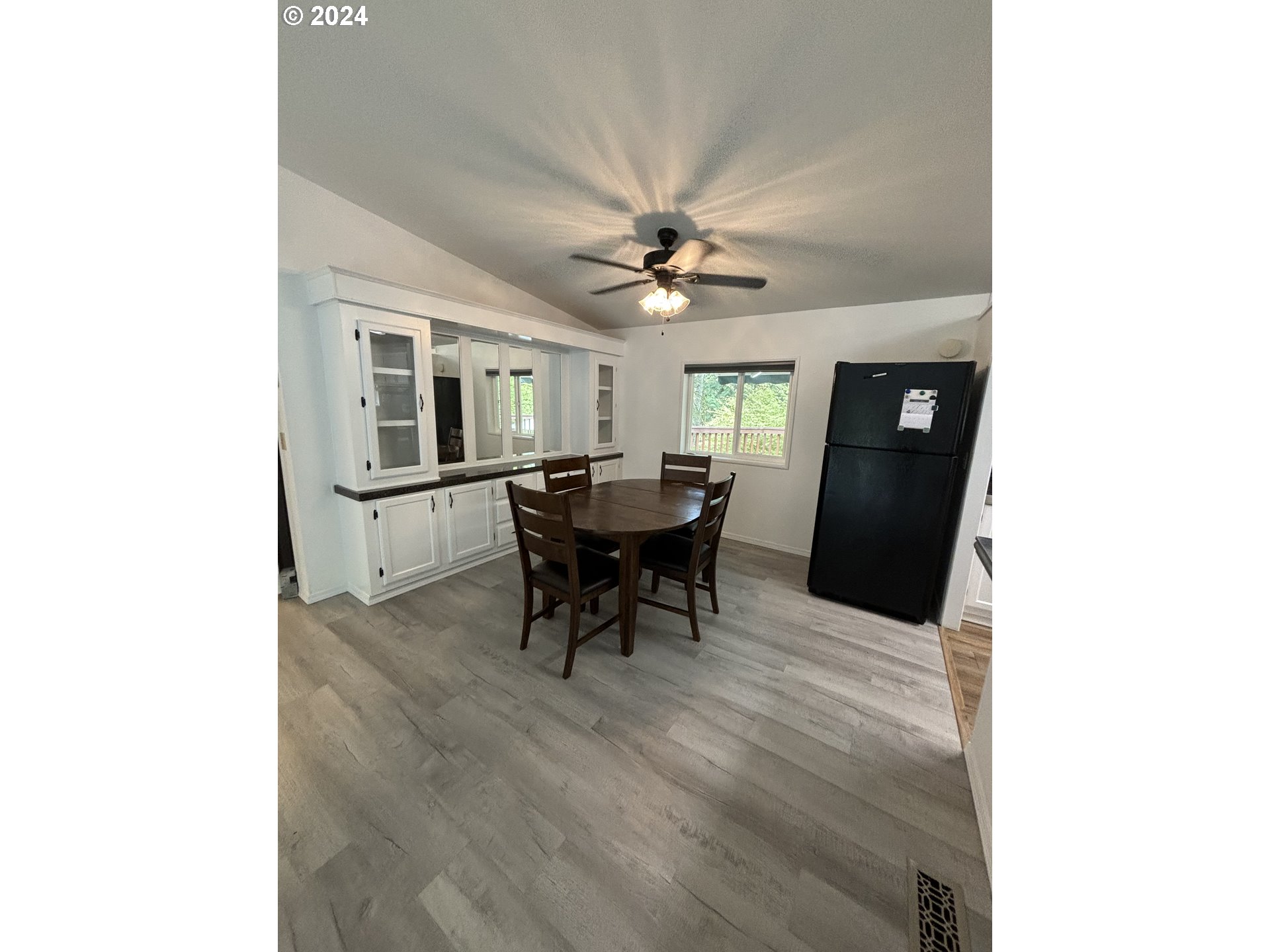 629 Coal Creek Road Longview, WA 98632 - Photo 14 of 26 a dining room with furniture and a chandelier