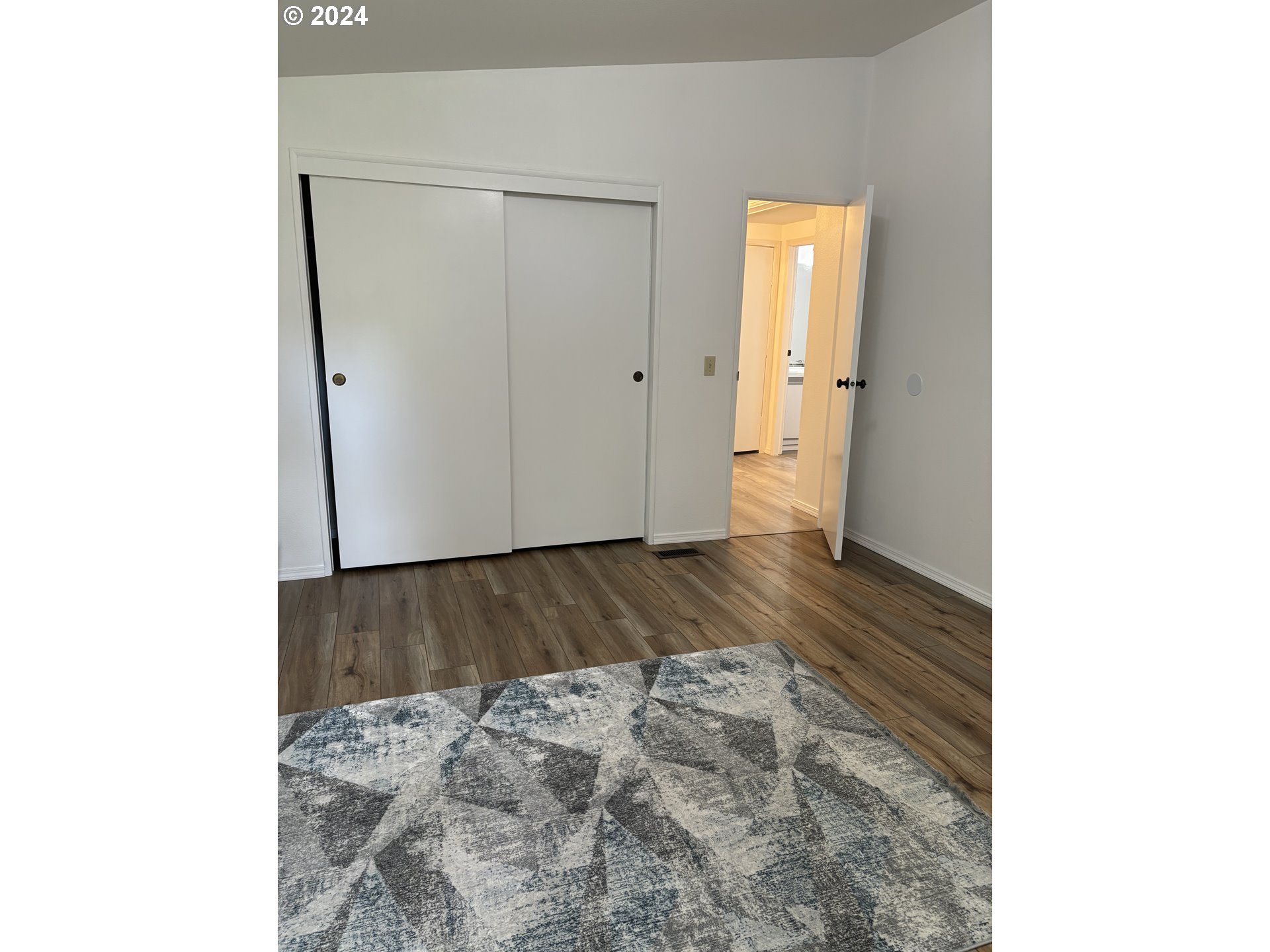 629 Coal Creek Road Longview, WA 98632 - Photo 15 of 26 a view of a room with wooden floor and a window