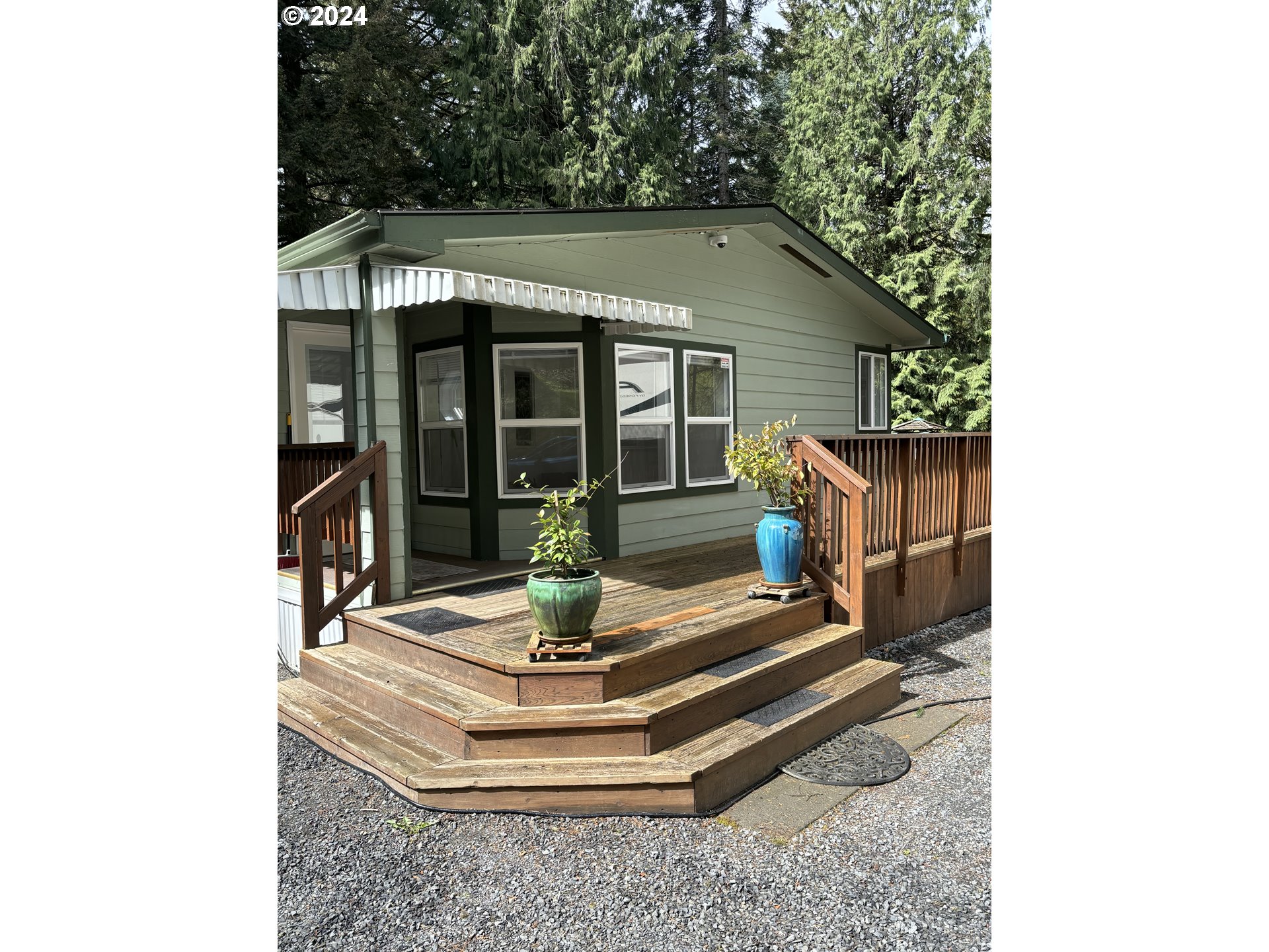629 Coal Creek Road Longview, WA 98632 - Photo 2 of 26 a view of a house with a small yard and plants