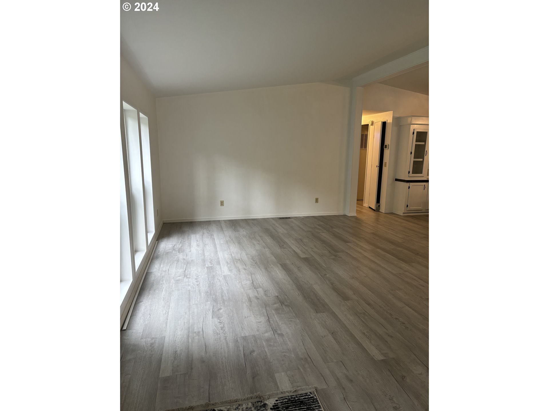 629 Coal Creek Road Longview, WA 98632 - Photo 5 of 26 a view of a room with wooden floor and a window