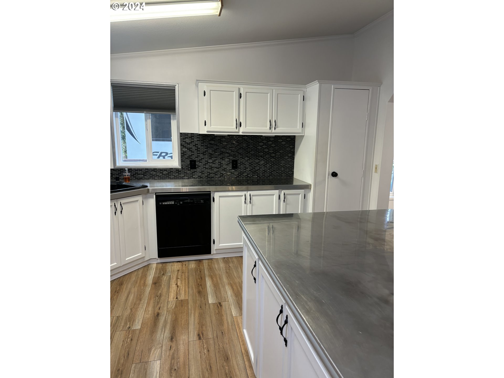 629 Coal Creek Road Longview, WA 98632 - Photo 10 of 26 a kitchen with a sink and cabinets