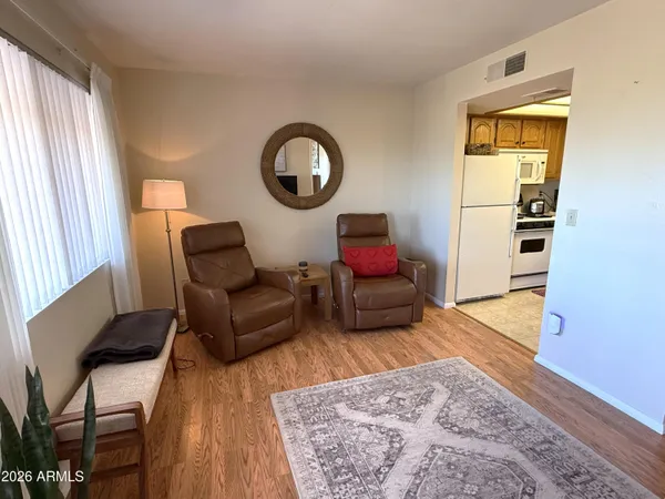 a living room with furniture and a rug