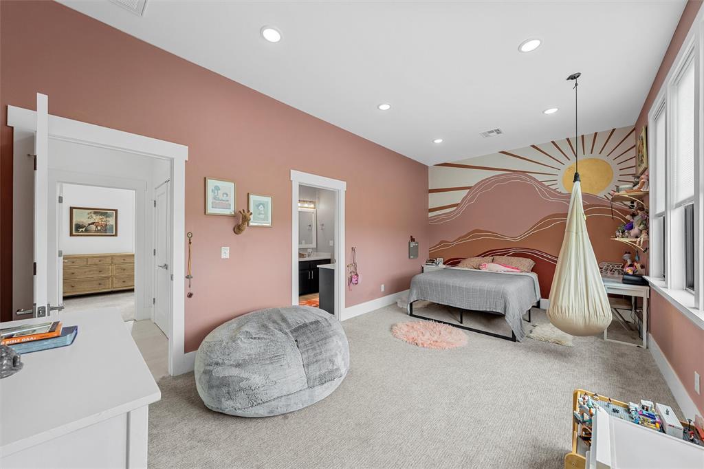 1197 Prairie Chapel Road Crawford, TX 76638 - Photo 31 of 40 Bedroom featuring an accent wall, recessed lighting, light carpet, baseboards, and wallpapered walls