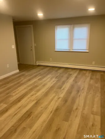 an empty room with a empty space and a window