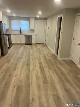a view of kitchen with wooden floor
