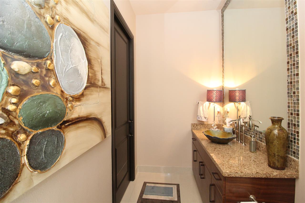 8314 Deer Ridge Boulevard Laredo, TX 78045 - Photo 13 of 20 a bathroom with a granite countertop sink and a mirror