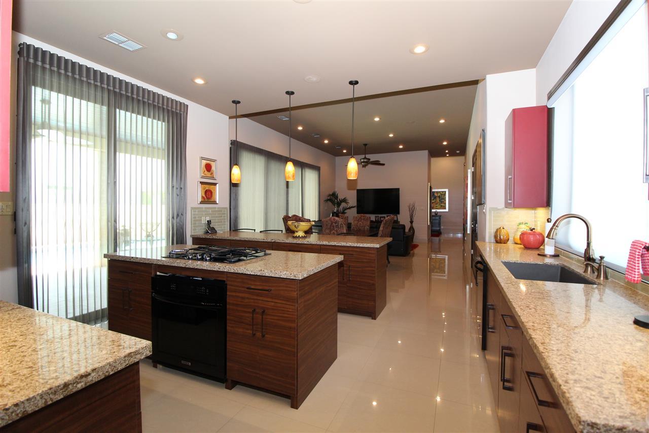 8314 Deer Ridge Boulevard Laredo, TX 78045 - Photo 8 of 20 a kitchen with stainless steel appliances granite countertop sink stove and refrigerator