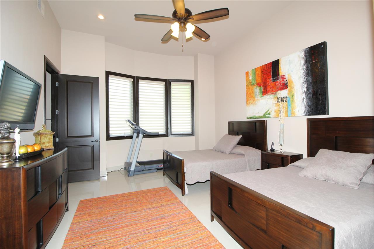 8314 Deer Ridge Boulevard Laredo, TX 78045 - Photo 9 of 20 a room with two separate beds and a flat screen tv