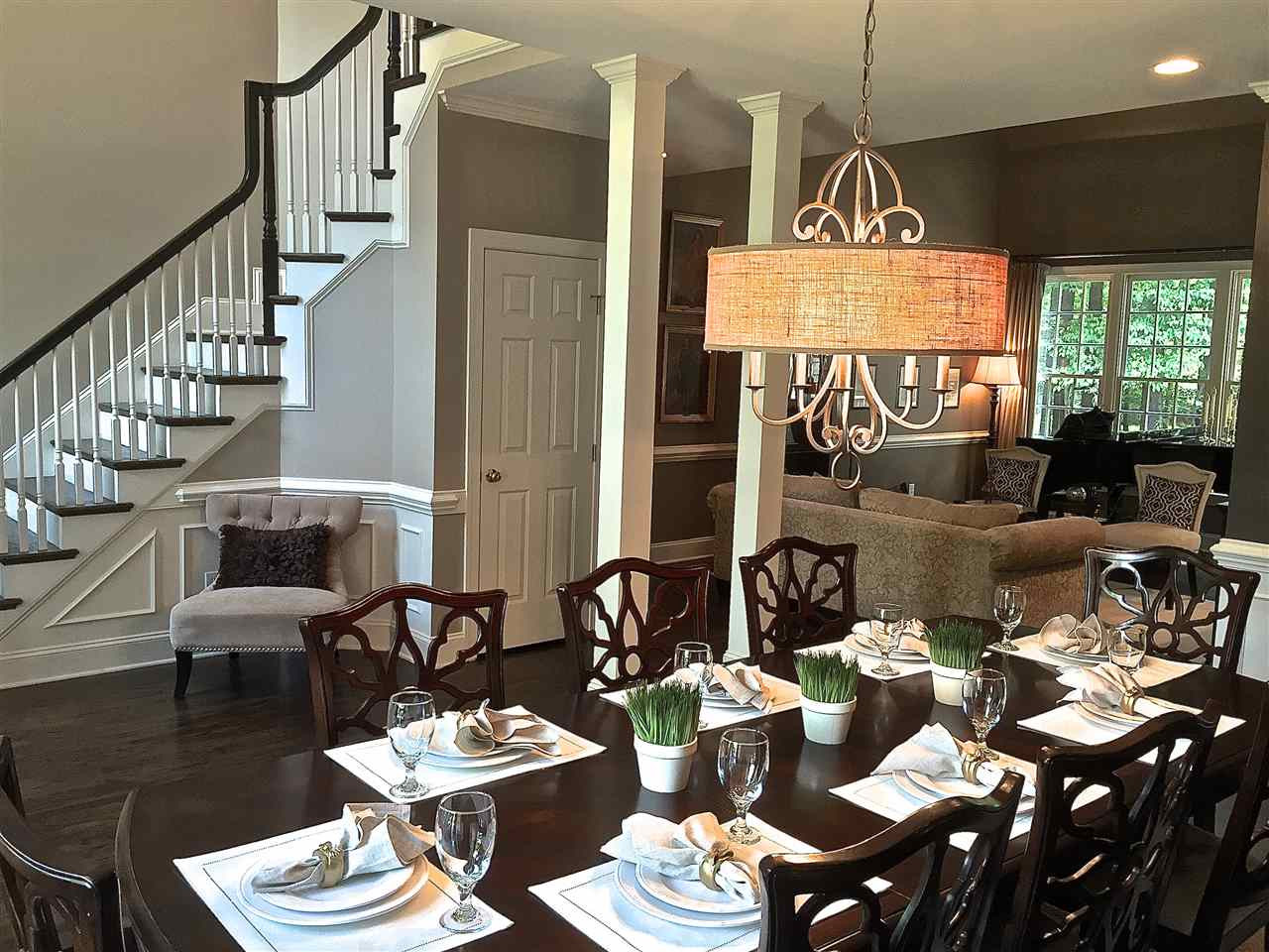5805 Sand Pebble Place Raleigh, NC 27613 - Photo 8 of 17 Large dining room with hardwood floors, wainscott and crown molding Dining Room