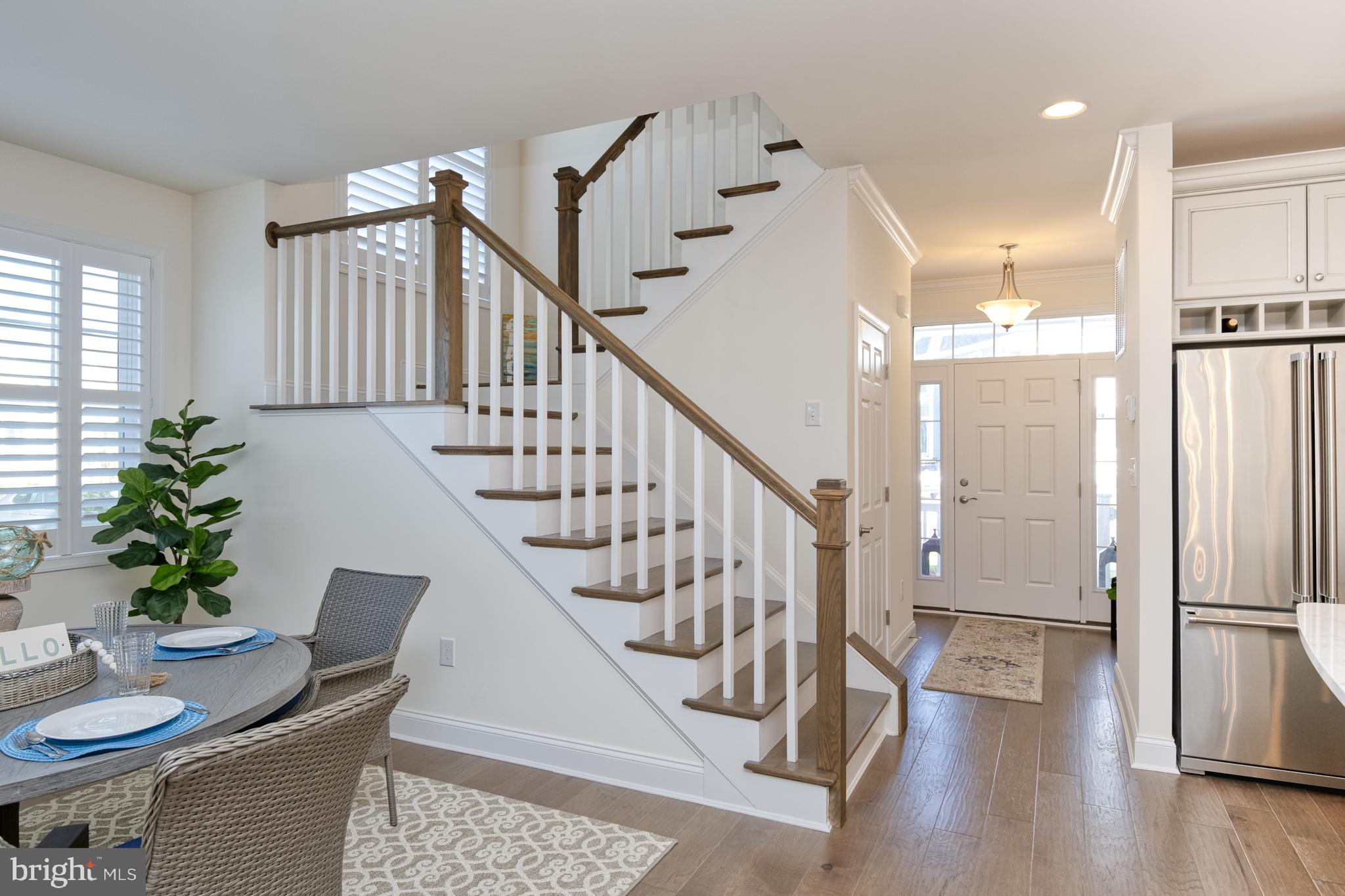 11313 Hall Road Lewes, DE 19958 - Photo 16 of 61 Stained wood stairs and banister