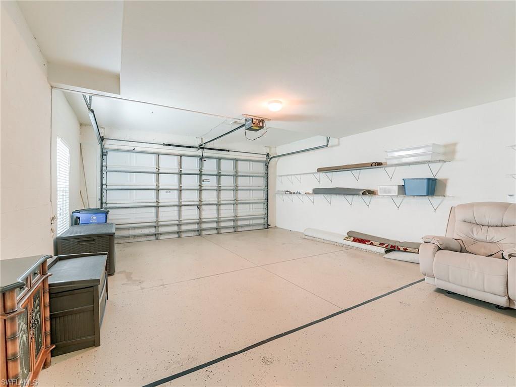 10751 Halfmoon Shoal Road, Unit 101 Estero, FL 34135 - Photo 33 of 45 ATTACHED 2-CAR GARAGE for convenience and storage