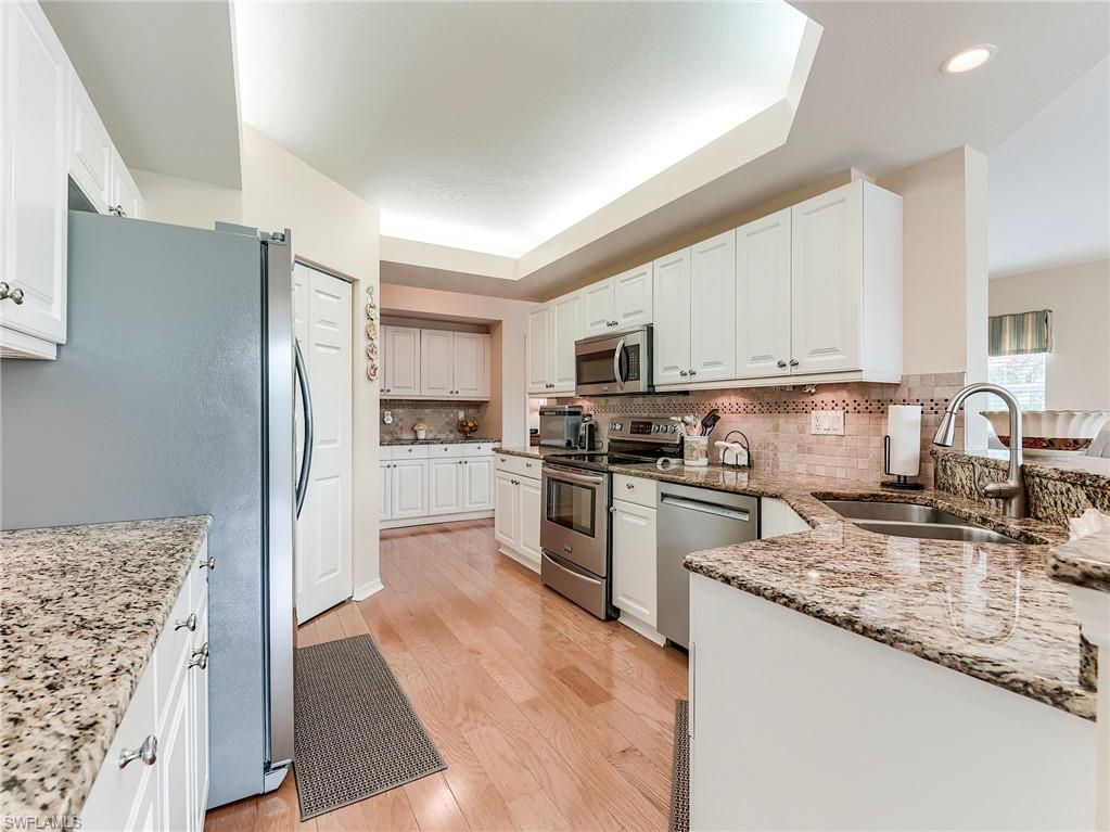 10751 Halfmoon Shoal Road, Unit 101 Estero, FL 34135 - Photo 7 of 45 Granite Countertopsand a Butler's Pantry