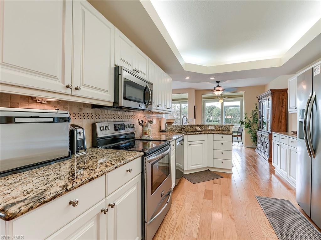 10751 Halfmoon Shoal Road, Unit 101 Estero, FL 34135 - Photo 9 of 45 Raised white panel cabinetry