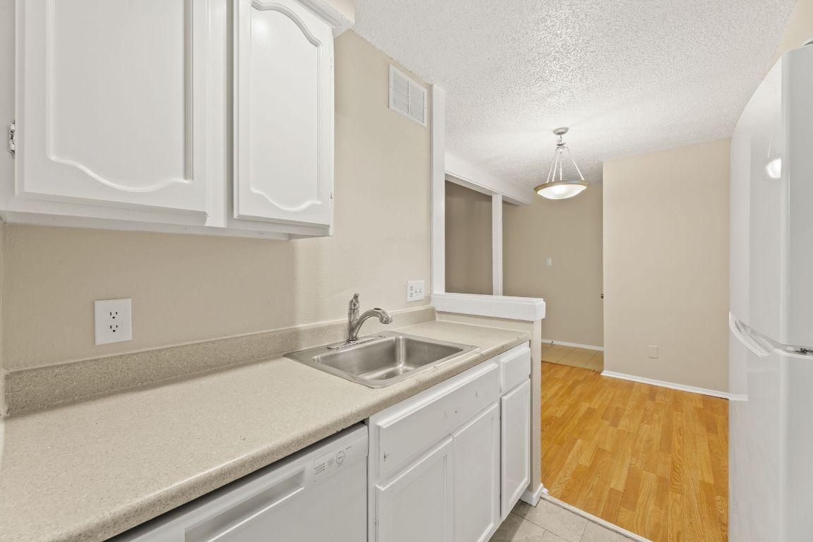 6901 Woodhue Drive, Unit A Austin, TX 78745 - Photo 20 of 34 a bathroom with a sink and a mirror