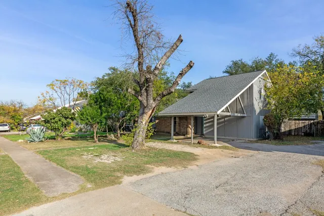 a house with trees in the background