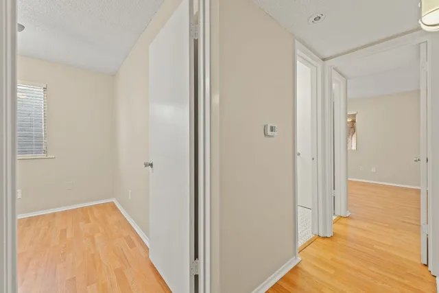 a view of a bathroom with wooden floor and staircase