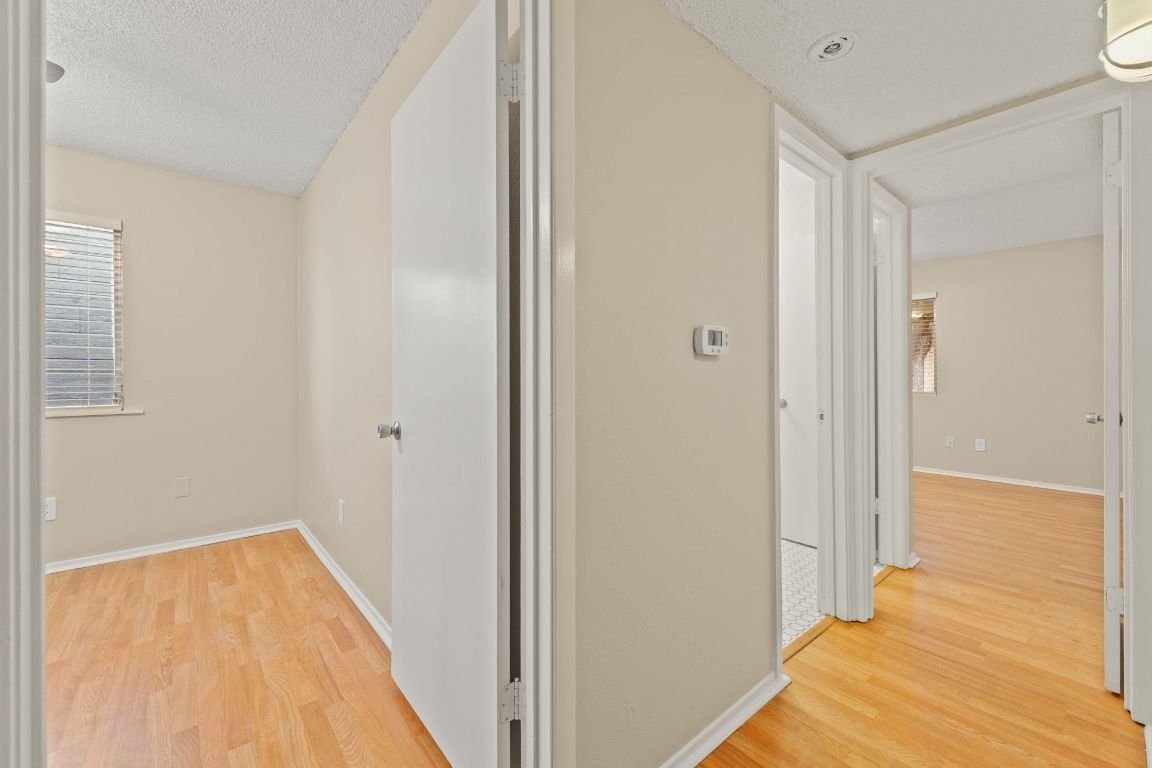 6901 Woodhue Drive, Unit A Austin, TX 78745 - Photo 21 of 34 a view of a bathroom with wooden floor and staircase