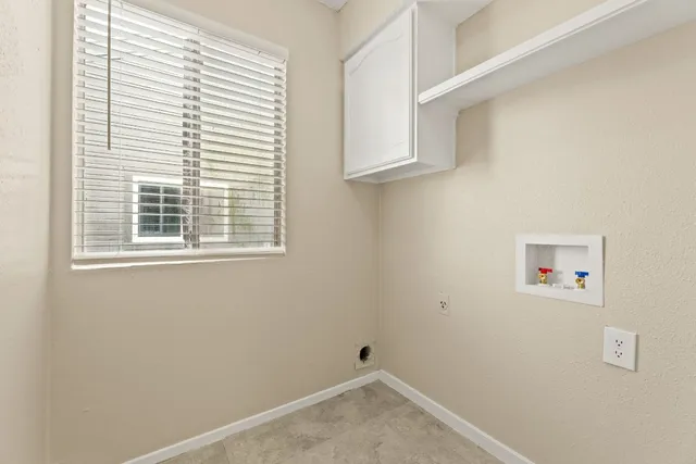 a view of a room that has a window in it