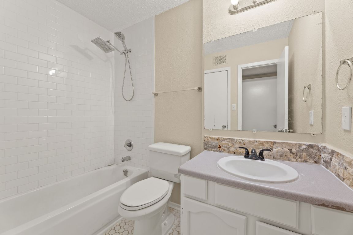 6901 Woodhue Drive, Unit A Austin, TX 78745 - Photo 25 of 34 a bathroom with a sink toilet and shower