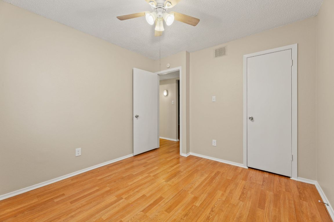 6901 Woodhue Drive, Unit A Austin, TX 78745 - Photo 28 of 34 a view of an empty room with wooden floor