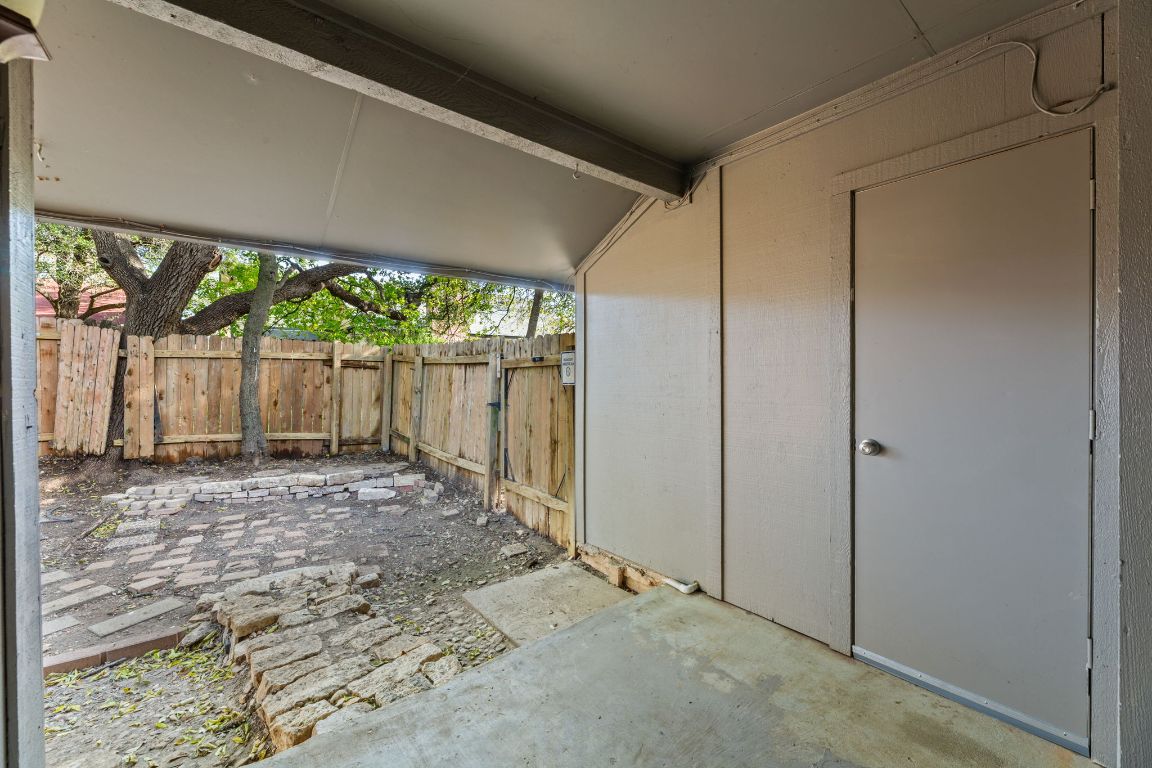 6901 Woodhue Drive, Unit A Austin, TX 78745 - Photo 30 of 34 a view of a backyard with large trees and a big yard