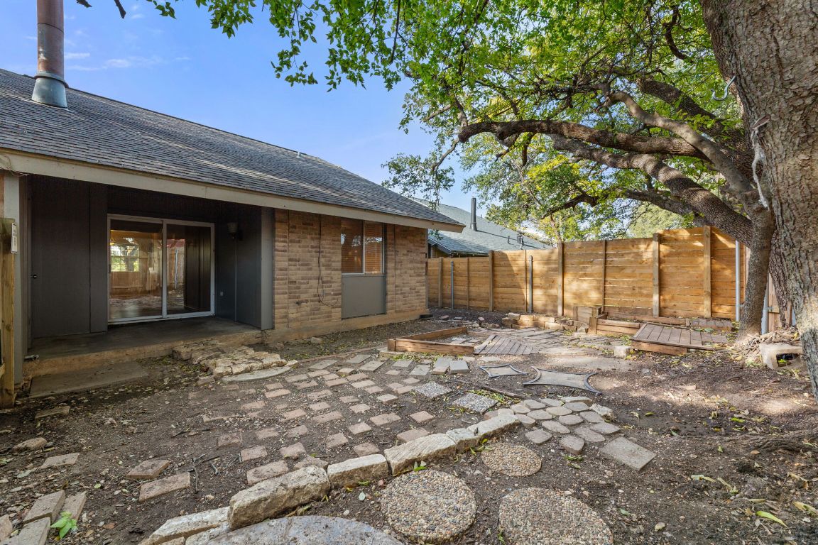 6901 Woodhue Drive, Unit A Austin, TX 78745 - Photo 31 of 34 a view of a house with a yard