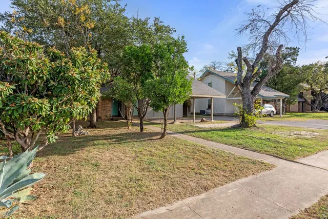 a house with trees in front of it