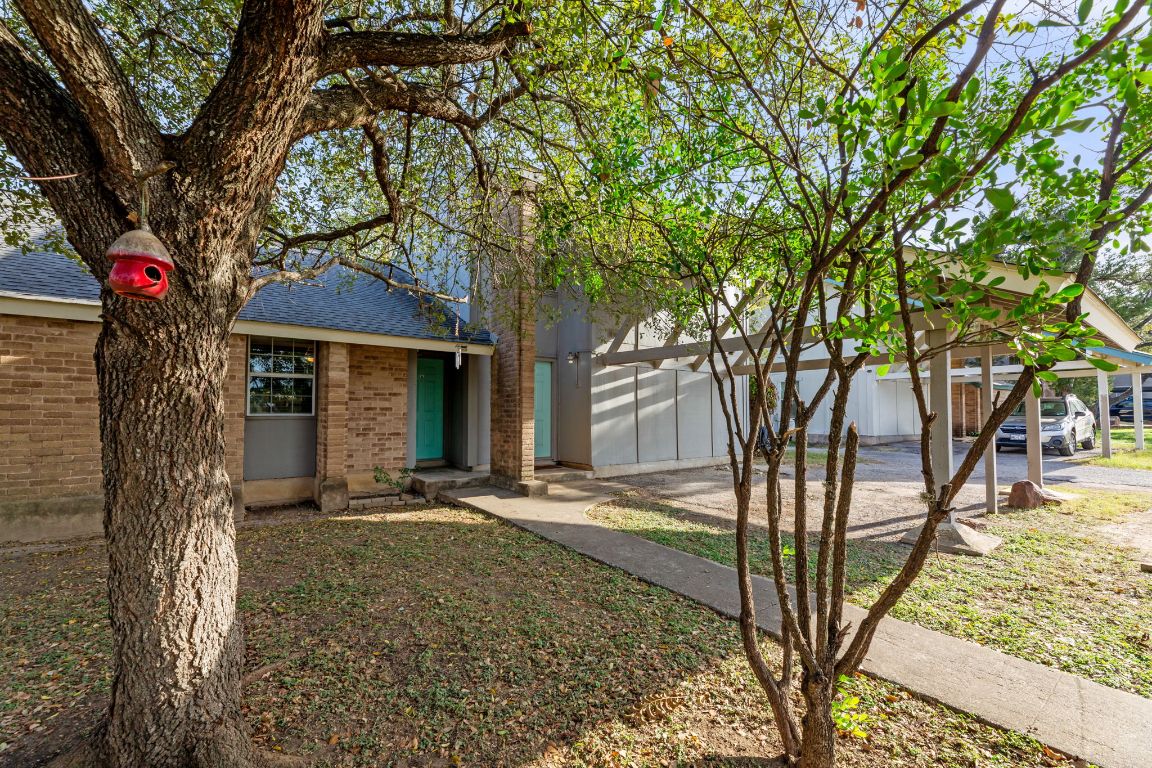 6901 Woodhue Drive, Unit A Austin, TX 78745 - Photo 6 of 34 a tree in front of a house with large tree