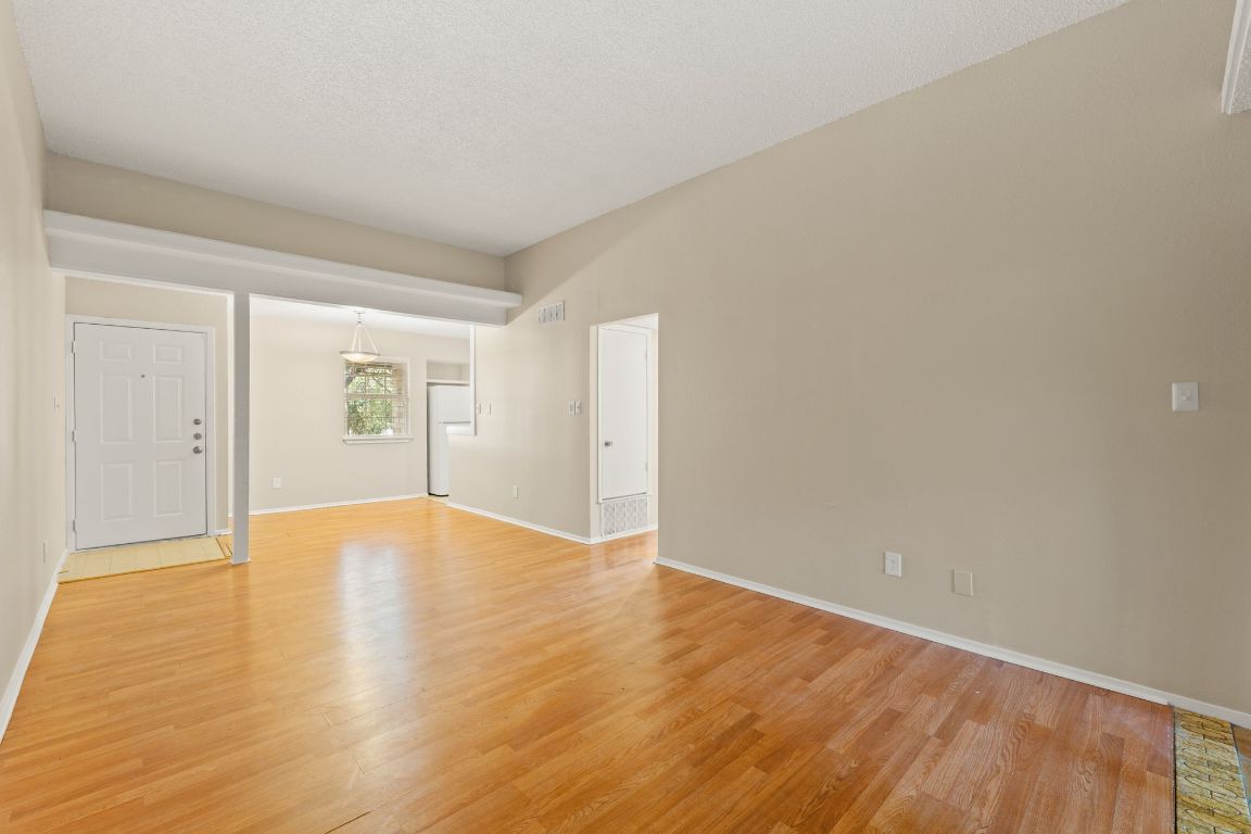 6901 Woodhue Drive, Unit A Austin, TX 78745 - Photo 8 of 34 wooden floor in an empty room