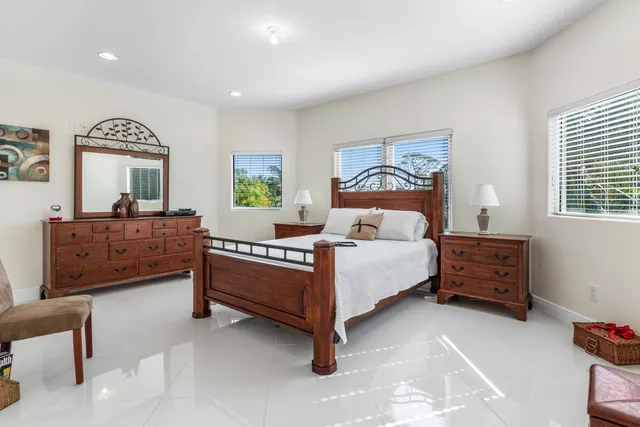 a bedroom with a bed and a dresser