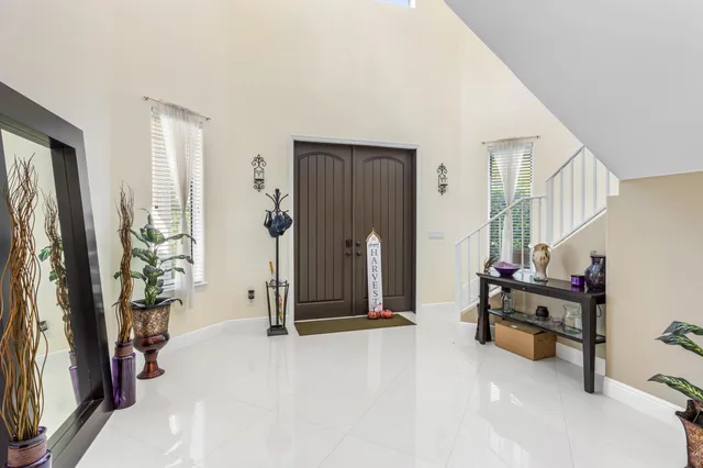 a view of an empty room and a window