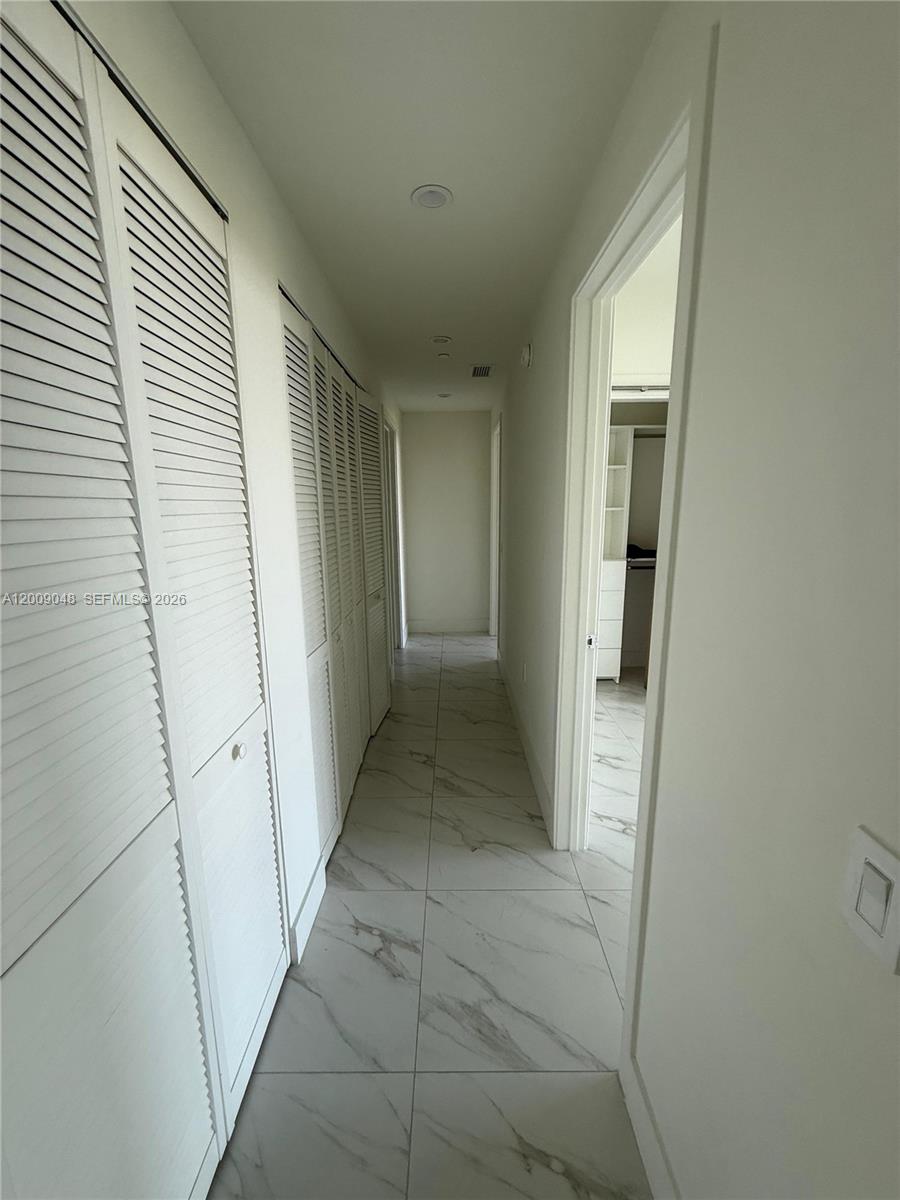 2000 Metropica Way, Unit 901 Sunrise, FL 33323 - Photo 11 of 25 a view of hallway with windows