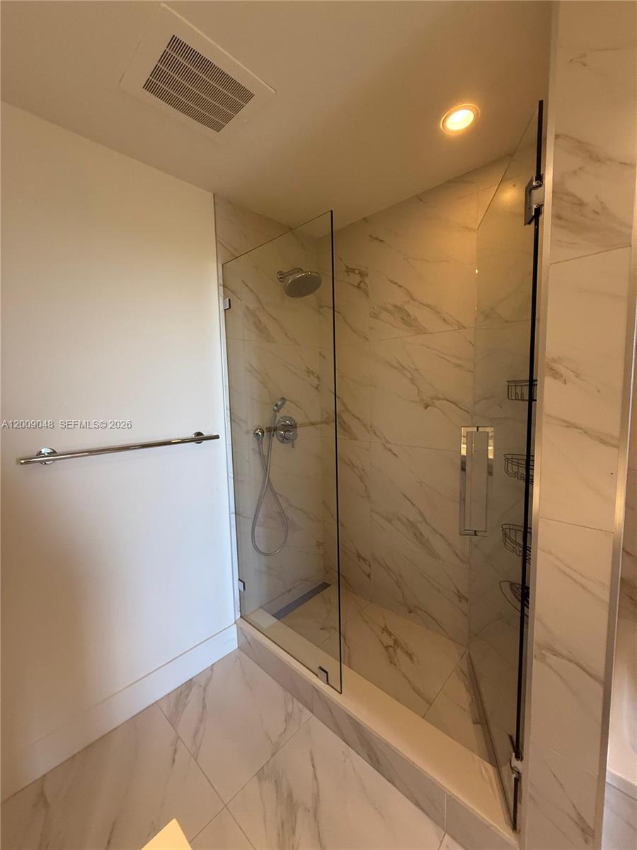 2000 Metropica Way, Unit 901 Sunrise, FL 33323 - Photo 12 of 25 a bathroom with a shower