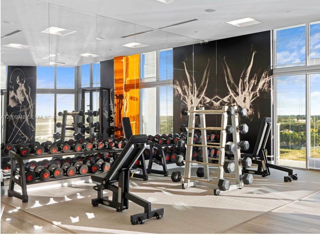 2000 Metropica Way, Unit 901 Sunrise, FL 33323 - Photo 24 of 25 a view of a room with gym equipment