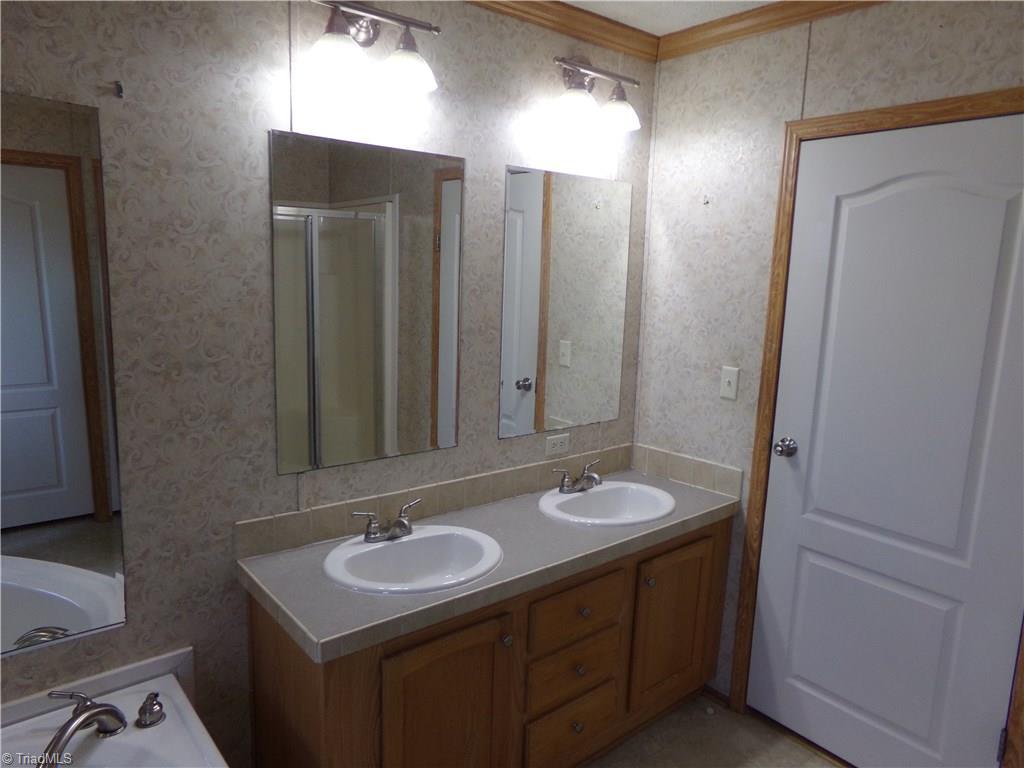 602 Booker T Womble Road Randleman, NC 27317 - Photo 13 of 26 His & Her sinks in master bath