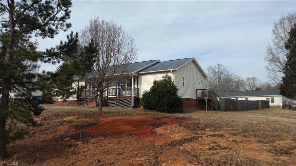602 Booker T Womble Road Randleman, NC 27317 - Photo 3 of 26 Right side view of home and Privacy Fence
