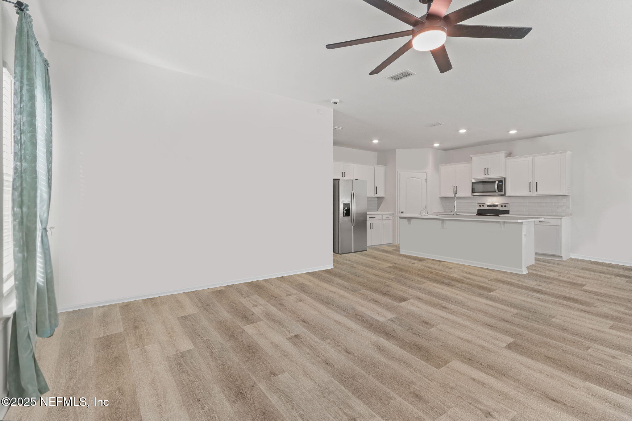2267 Shady Breeze Ln Green Cove Springs Green Cove Springs, FL 32043 - Photo 13 of 17 a view of a kitchen with a sink and a refrigerator