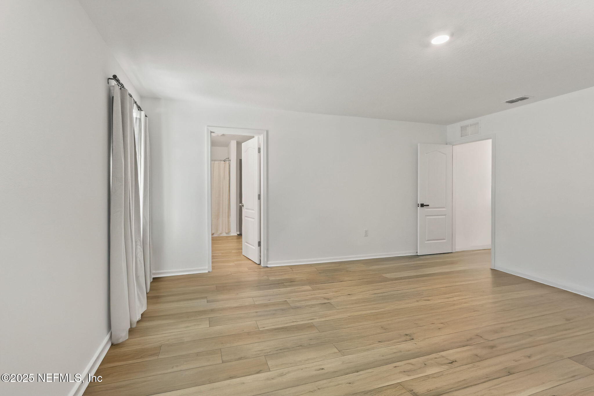 2267 Shady Breeze Ln Green Cove Springs Green Cove Springs, FL 32043 - Photo 16 of 17 a view of an empty room with wooden floor