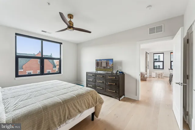 a bedroom with a bed and a dresser