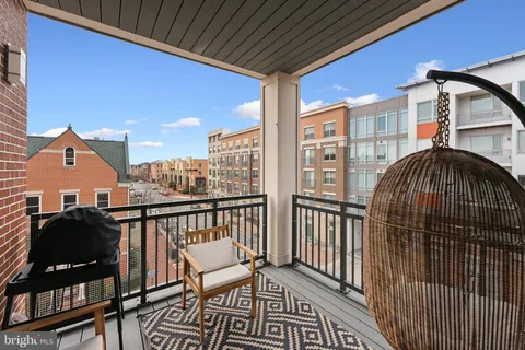 a view of a balcony with furniture