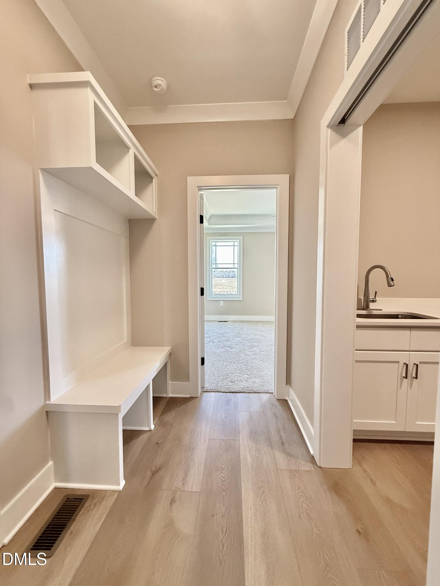 5549 River Buck Rd Spring Spring Hope, NC 27882 - Photo 15 of 35 a view of a hallway with wooden floor and cabinet