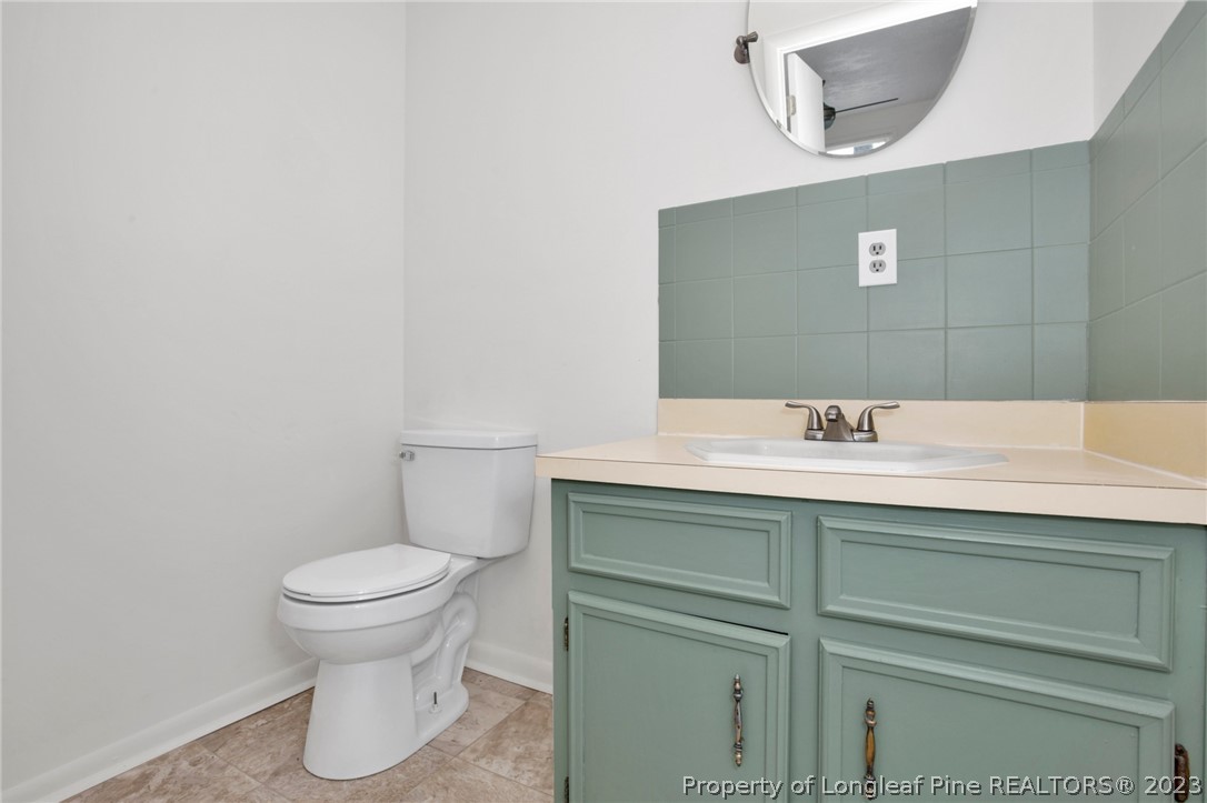 997 Balfour Road Red Springs, NC 28377 - Photo 12 of 15 a bathroom with a sink and a toilet