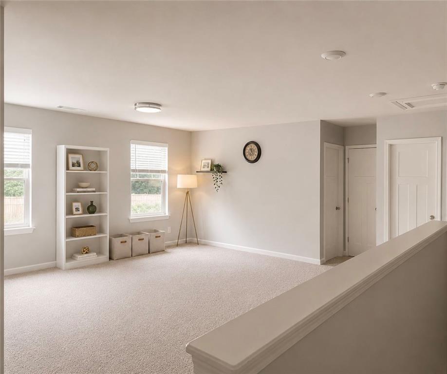 3359 Elkhorn Ridge Run Dacula, GA 30019 - Photo 18 of 35 an empty room with windows