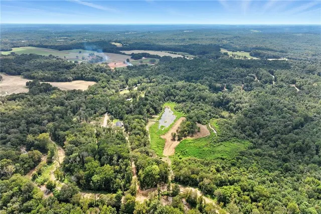 a view of a house with backyard porch and sitting area