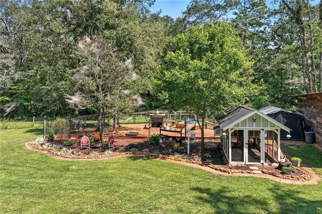 731 Borders Road Commerce, GA 30530 - Photo 37 of 75 a view of a house with swimming pool and sitting area