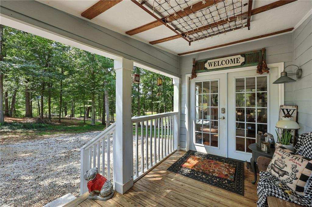 731 Borders Road Commerce, GA 30530 - Photo 41 of 75 a view of a porch with wooden floor and fence