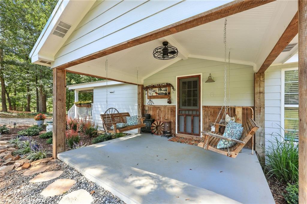 731 Borders Road Commerce, GA 30530 - Photo 42 of 75 a front view of a house with outdoor seating