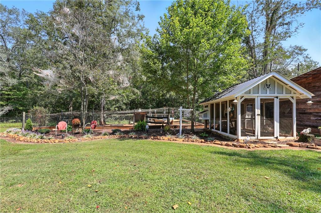 731 Borders Road Commerce, GA 30530 - Photo 45 of 75 a view of a chairs and tables in a yard